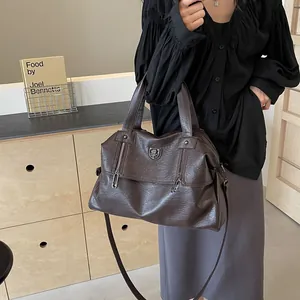 Vintage dark brown leather tote bag with large capacity for travel and daily commute