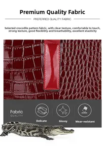 Dettaglio macro della pelle goffrata coccodrillo rosso vino con finitura lucida e trama