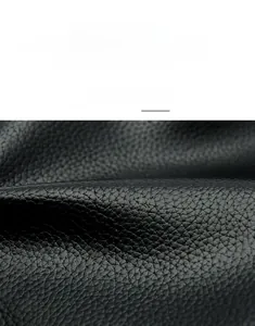 Close-up of black lychee grain faux leather texture showing soft matte finish and detail