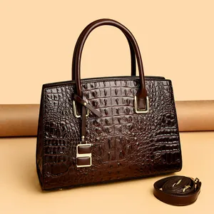 Deep brown crocodile embossed tote bag with gold hardware and top handle for women