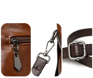 Macro detail of gunmetal drop zipper pull and metallic strap swivel hook on brown leather bag