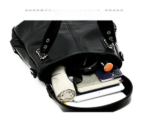 Interior detail of large black lychee leather tote bag showing spacious storage capacity