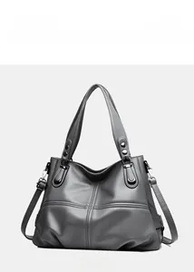 Close-up of gray lychee texture tote bag with silver hardware and detailed stitching