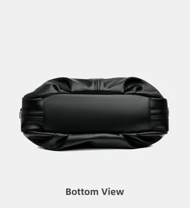 Detailed bottom view of black litchi pattern leather tote bag showing wide rectangular base