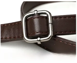 Detail view of brown pebbled leather strap with polished silver adjustable buckle