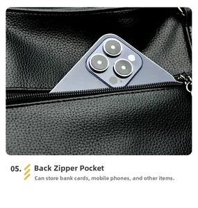 Detail of the back zipper pocket on a black litchi pattern tote bag for smartphones