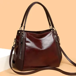 Retro burgundy faux leather tote bag with silver zippers and adjustable shoulder strap