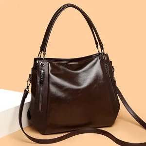 Classic dark brown vintage tote bag in glossy leather for versatile daily commuting