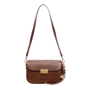 Retro brown leather square shoulder bag with gold hardware and shell pendant