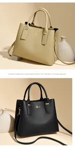 Detailed view of two faux leather handbags featuring litchi texture and golden kangaroo logo