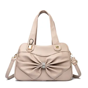Borsa beige con fiocco di strass e tracolla regolabile per donna