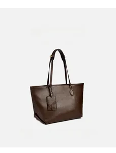 Detail of soft dark brown leather tote bag with lychee grain texture and metal buckle