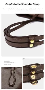 Detail of comfortable wide shoulder straps with golden metal buttons on brown leather tote bag