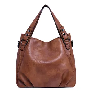 Retro brown faux leather tote bag with pleated detail and metal rings for women