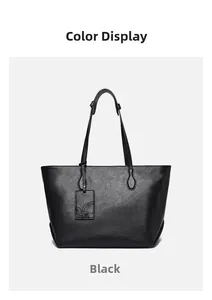 Macro detail of high-quality black faux leather tote bag with soft matte wrinkled texture