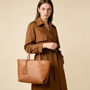 Brown soft leather tote bag with large capacity shown in a stylish autumn fashion shoot