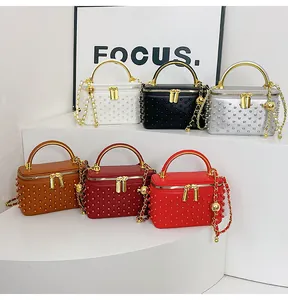 Detail of mini box bags featuring beaded texture, metal handles and chain straps in 6 colors