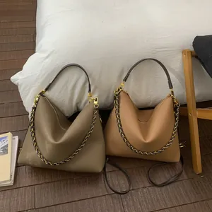 Large soft leather tote bags in khaki and caramel with braided chain and adjustable straps