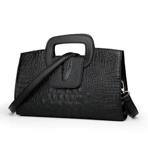 Bolso de mano negro con motivo de cocodrilo, relieve de cabeza de caimán y asa cuadrada