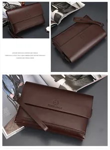 Macro-opname van de donkerbruine zakelijke clutch met logo-reliëf en metalen ritssluiting