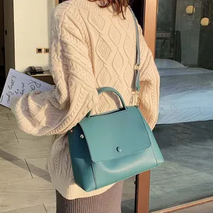 Minimalist large capacity teal shoulder bag with wide woven strap for women 2025