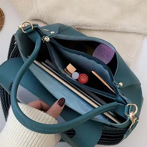 Deep green large capacity tote bag with internal compartments and geometric strap