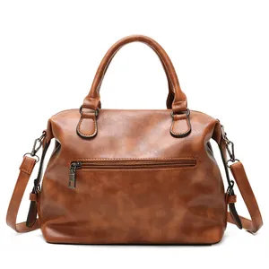 Brown vintage PU leather Boston bag with double handles and adjustable shoulder strap