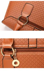 Macro view of tan leather bag showing diamond quilted texture and golden metal hardware