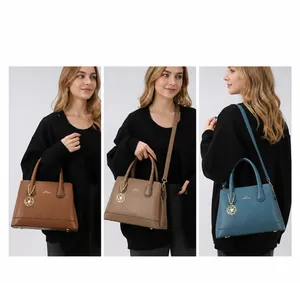 Close-up of textured faux leather tote with metallic flower charm and various carrying styles