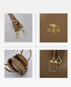 Détails du sac cabas en cuir marron grainé avec boucles dorées et bandoulière réglable