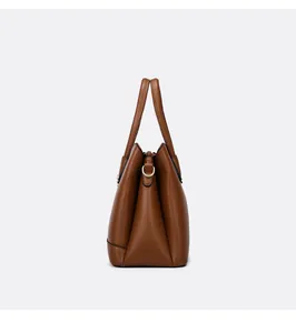 Detail shot of a dark brown tote bag with a three-layer gusset design and metal D-ring