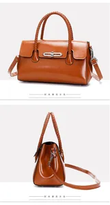 Detail view of brown satchel featuring a unique woven handle and elegant metal buckle