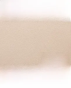Close-up of litchi pattern synthetic leather texture and kangaroo logo embossing