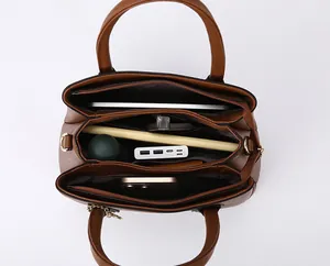 Internal compartments of large tote bag showing space for tablet, umbrella and bottle