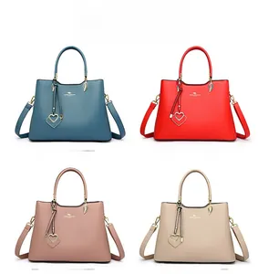 Color display of stylish trapezoid handbags in teal blue, red, pink and khaki finishes