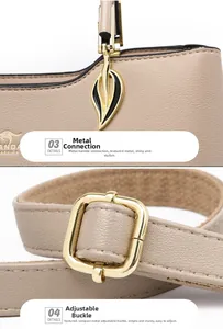 Detail view of gold leaf-shaped hardware and adjustable shoulder strap on beige leather bag
