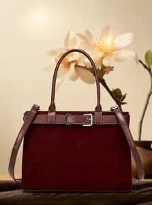 Macro detail of wine red frosted tote bag with belt buckle and premium suede texture