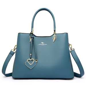 Litchi pattern blue leather tote bag with gold heart pendant and adjustable strap