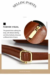 Detail view of the brown leather tote bag with gold zipper and adjustable strap stitching