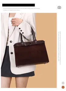 Detail view of deep brown suede tote bag with leather straps and silver metal buckles