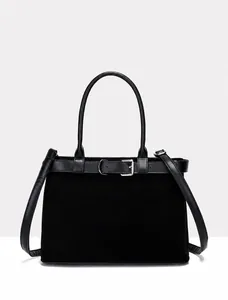 Detail of black matte and leather belt bag with metal buckle and shoulder strap