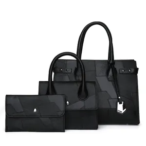 Three-piece black tote bag set with geometric patchwork and metallic charms for women