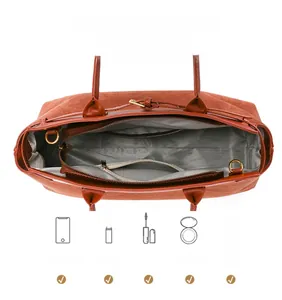 Interior detail of large brown tote bag showing multi-compartment lining and zipper pocket