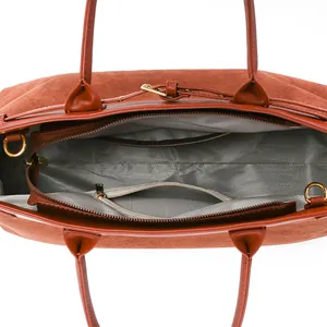 Brown faux suede tote bag with internal zipper compartment and herringbone lining