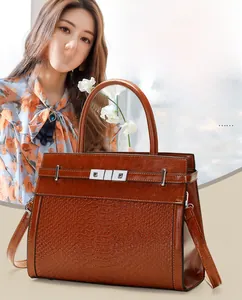 Brown faux leather crossbody bag featuring animal texture and detachable strap for women