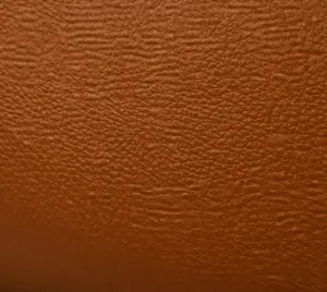 Vue macro détaillée de la texture du cuir litchi marron et du matériau de qualité supérieure