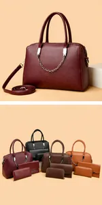 Makro-Detail des Handtaschen-Sets aus hochwertigem Litschi-Leder mit silbernen Kettendetails