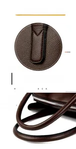 Détails des poignées renforcées et coutures sur le sac cabas marron en cuir grainé