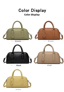 Selection of retro Boston bags in five colors with a detachable strap and smiley charm