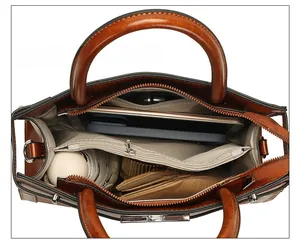 Top view of spacious interior compartments holding a tablet, phone and wallet